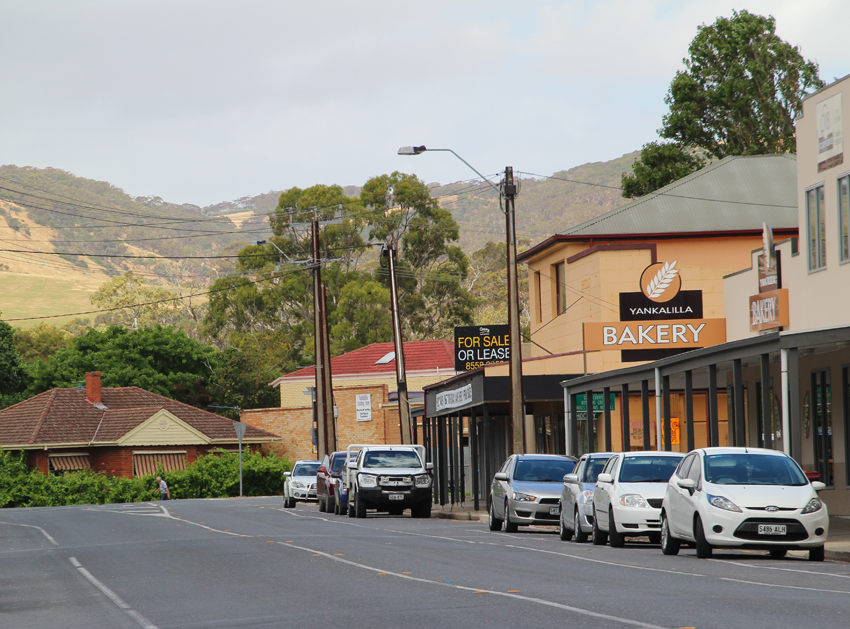 Yankalilla's main street with bakery and surrounding hills visible